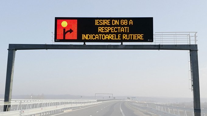 LED traffic guidance screen on highway displaying electronic message for road safety