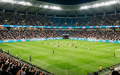 Sports stadium LED display system driven by NovaStar VX600 controller with fiber transmission