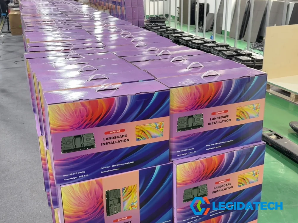 Finished goods inventory of color-boxed Ehonor LED screen cabinets staged in LEGIDATECH warehouse ready for shipment