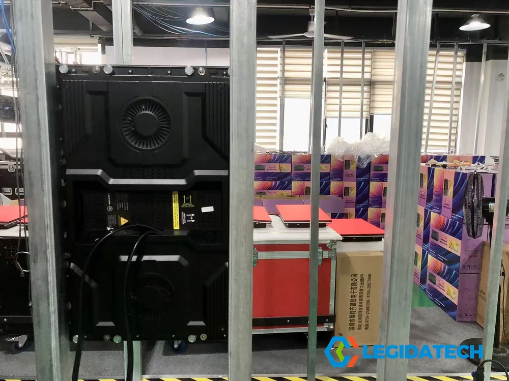 Warehouse storage area with packed Ehonor LED screen cabinets organized for international order fulfillment at LEGIDATECH