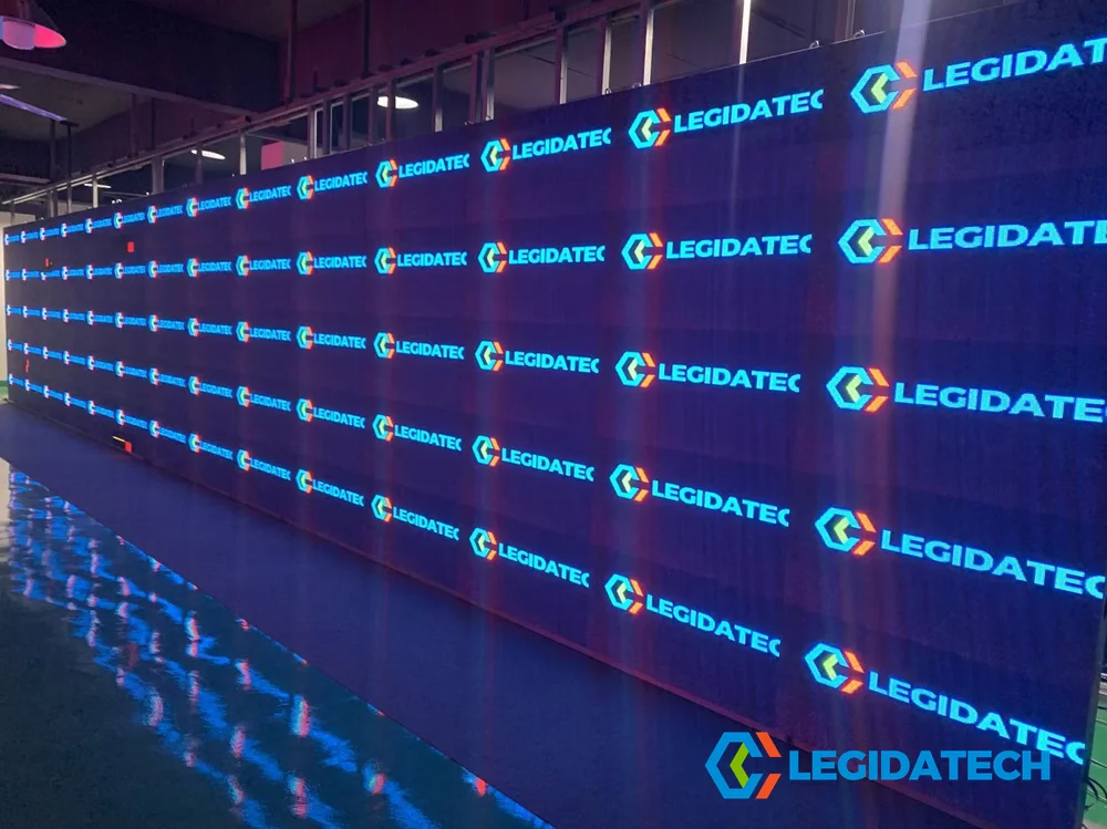 Wall-mounted Ehonor LED display panels undergoing continuous 72-hour burn-in aging test with electronic monitoring at LEGIDATECH