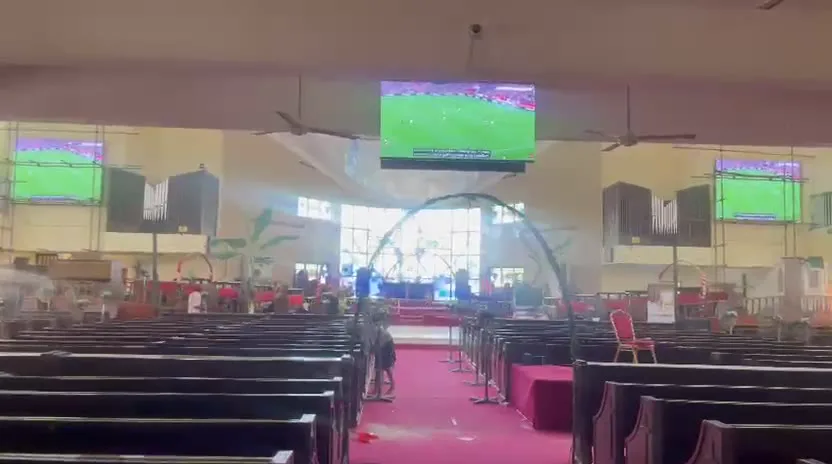 Wide view of church sanctuary with LED screens at Hoares Memorial Methodist Cathedral, Lagos, Nigeria