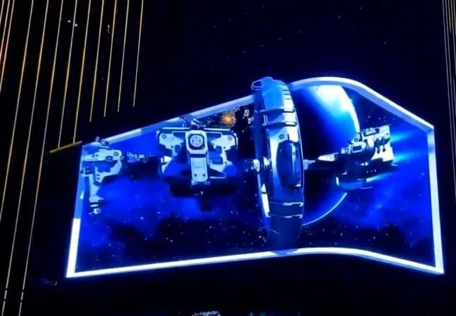Outdoor 3D LED screen at a shopping mall entrance showing a spaceship 3D animation