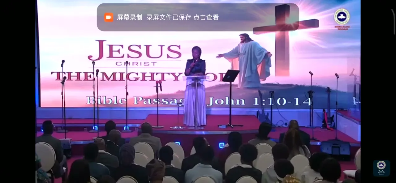 Video still: church stage with cross and LED display at RCCG Church Ireland