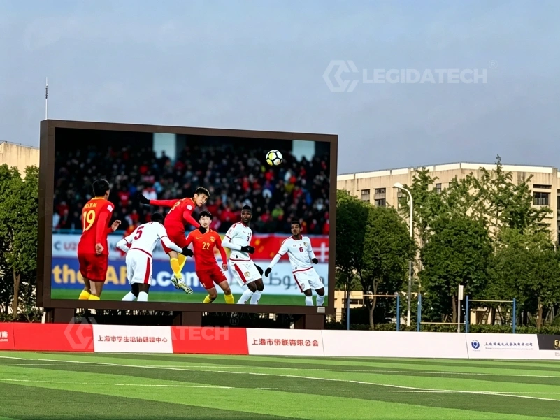 1000x1000mm outdoor LED display used as a stadium scoreboard and perimeter screen under floodlights