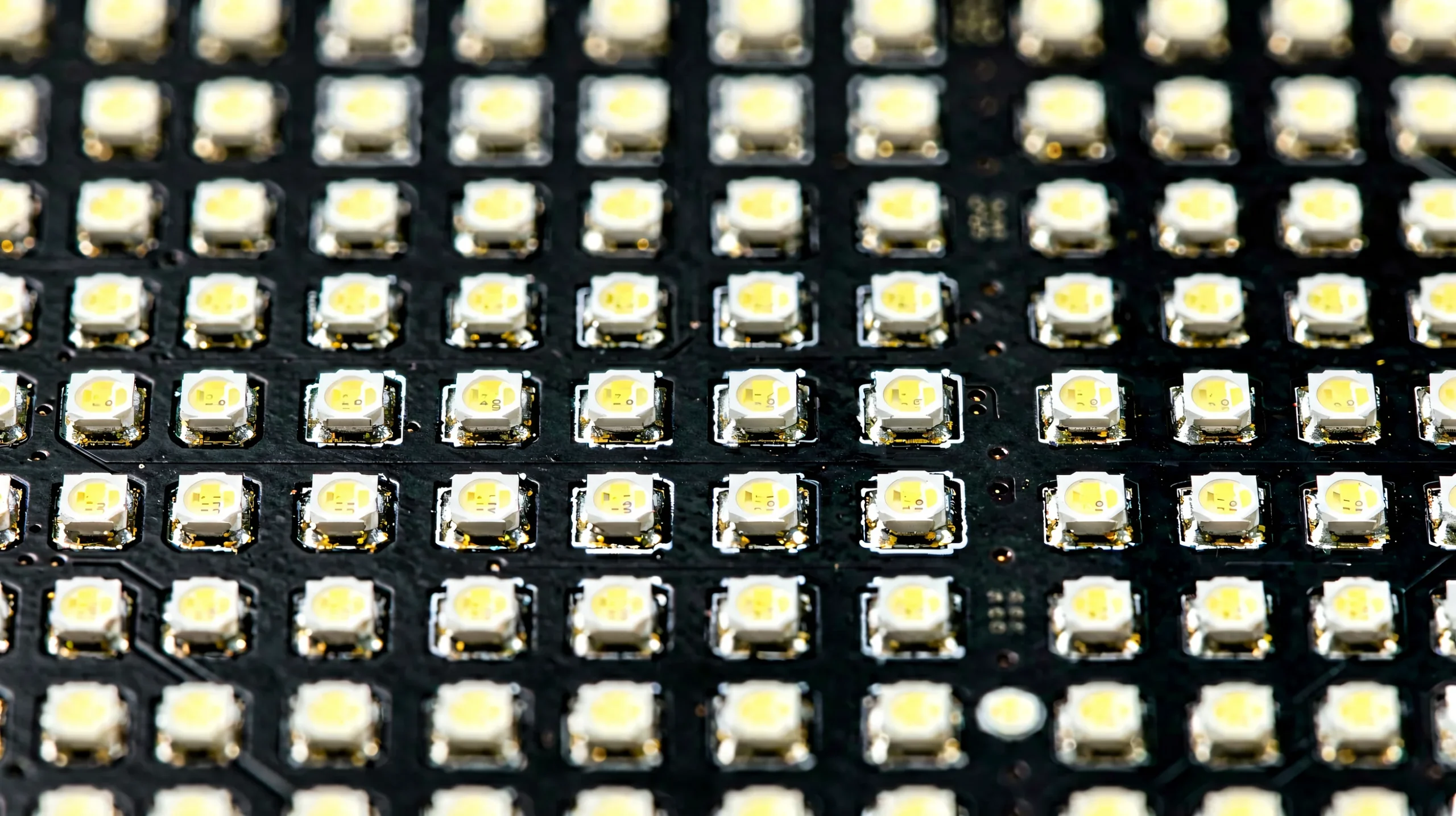 Macro close-up of a fine-pitch LED module with uniform black-face SMD pixels