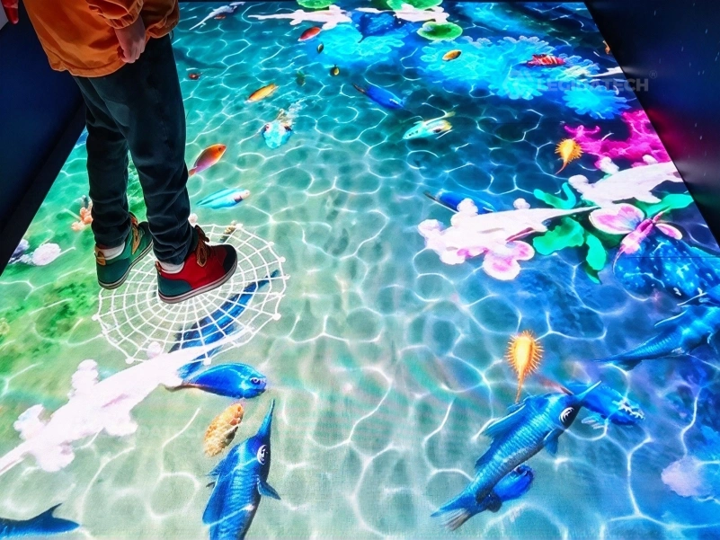 Visitors triggering ripples on a P3.91 interactive LED dance floor installation