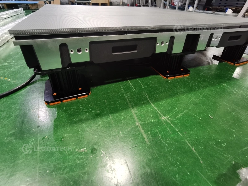 Cabinets of the interactive floor aligned during installation showing the load-bearing structure