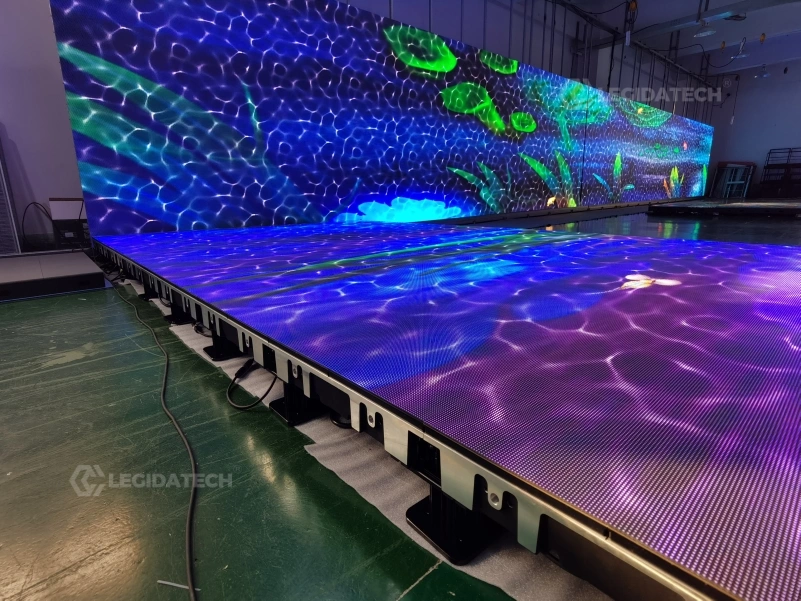 Ground-level view of the interactive floor surface showing flush seams and anti-slip texture