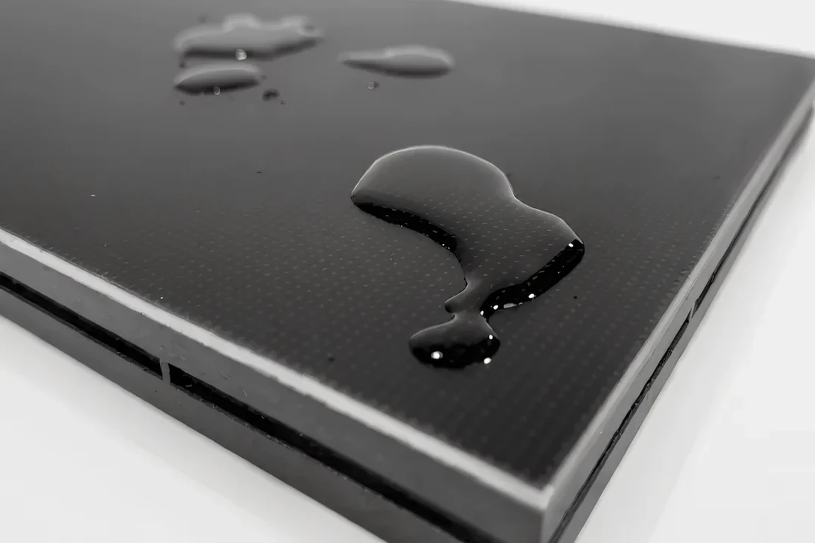 Water droplets beading on a sealed COB LED module front surface during a waterproof test