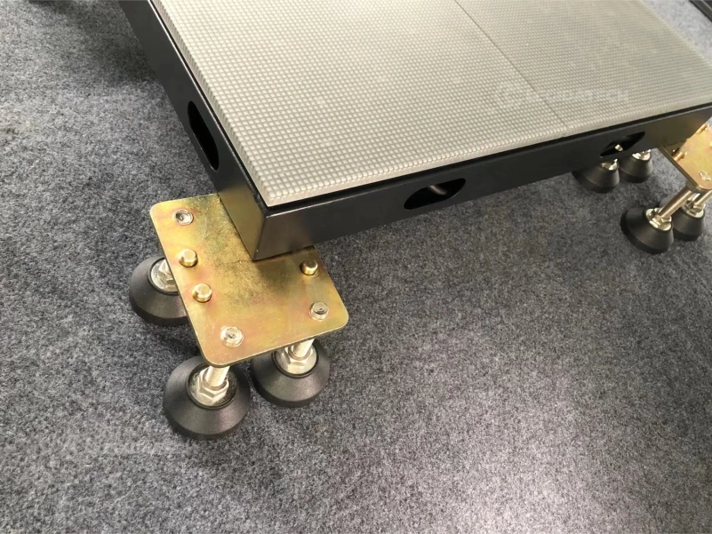 Gold foot plate and black rubber adjustable foot detail on the underside of a 500x1000mm LED floor cabinet