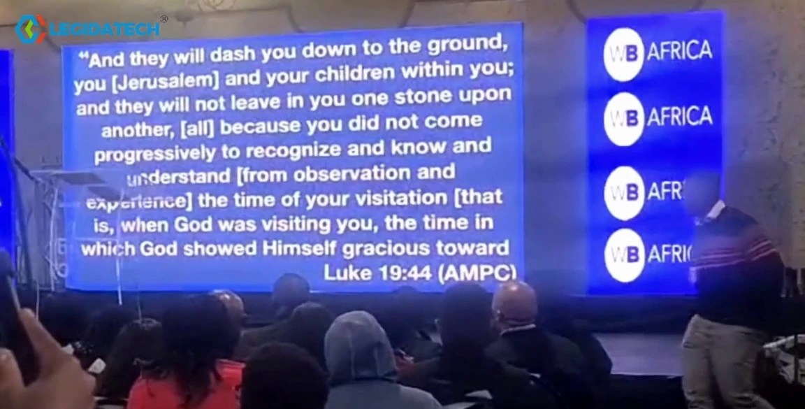 Church LED screens at a conference in Kenya showing scripture on the main display