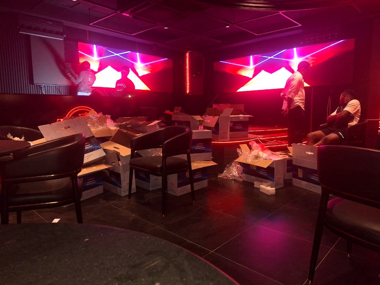 Photo from the project site: both 3.84 x 0.96 m P2.5 nightclub LED screens playing content while installation finishes at Toppest in Lekki, Lagos